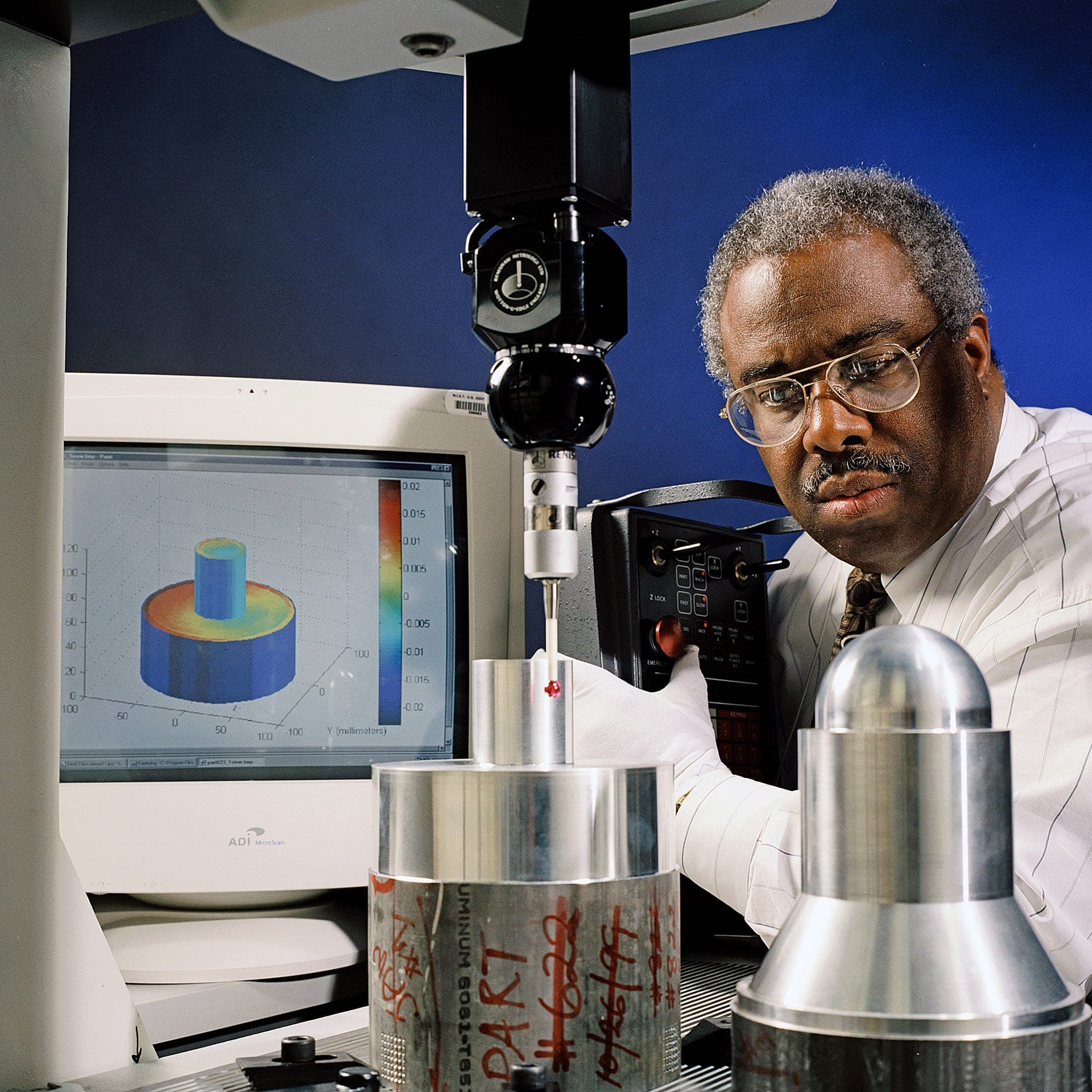 Coordinate measuring machine performing dimensional inspection