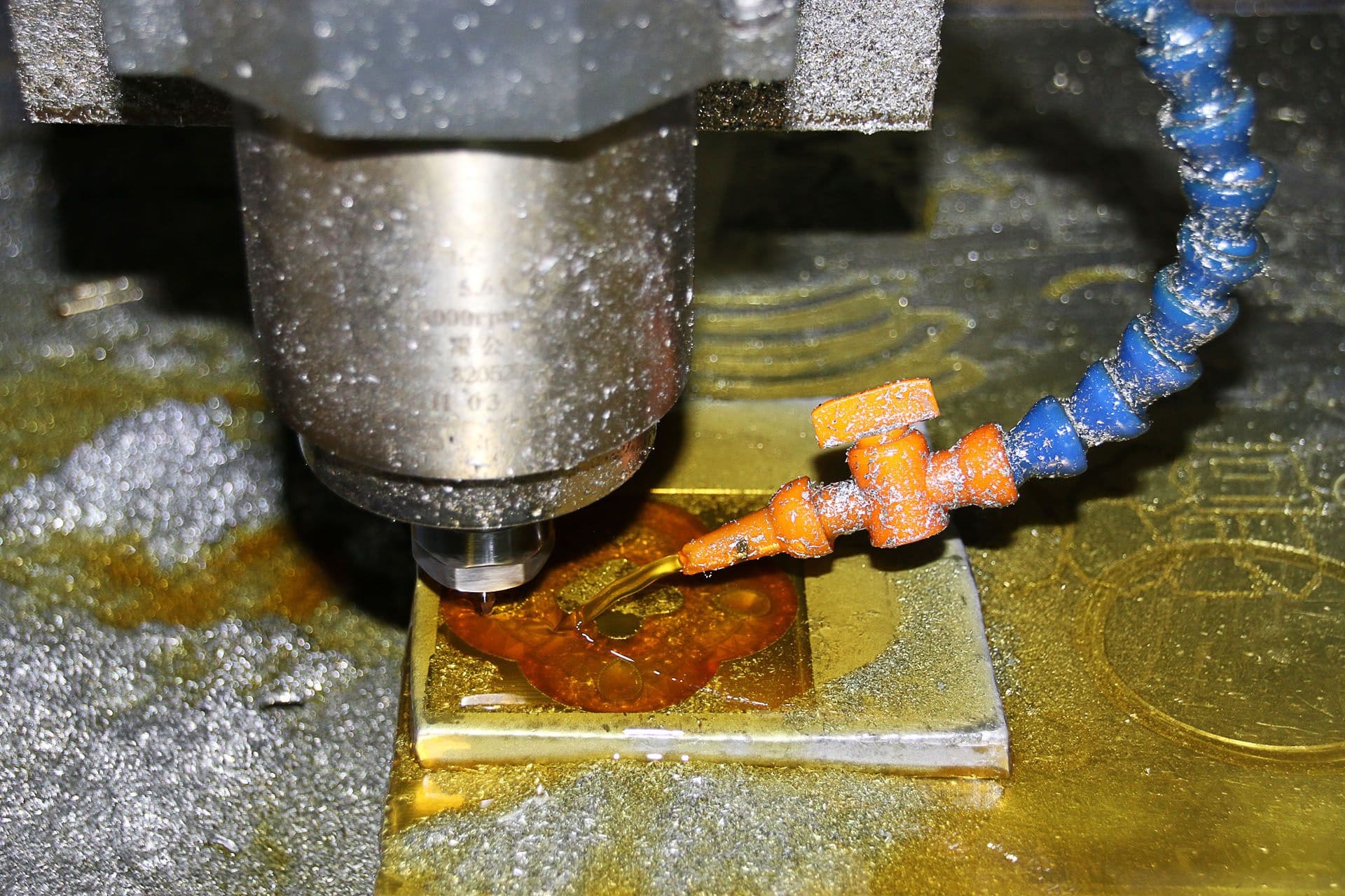 CNC milling machine cutting a metal workpiece