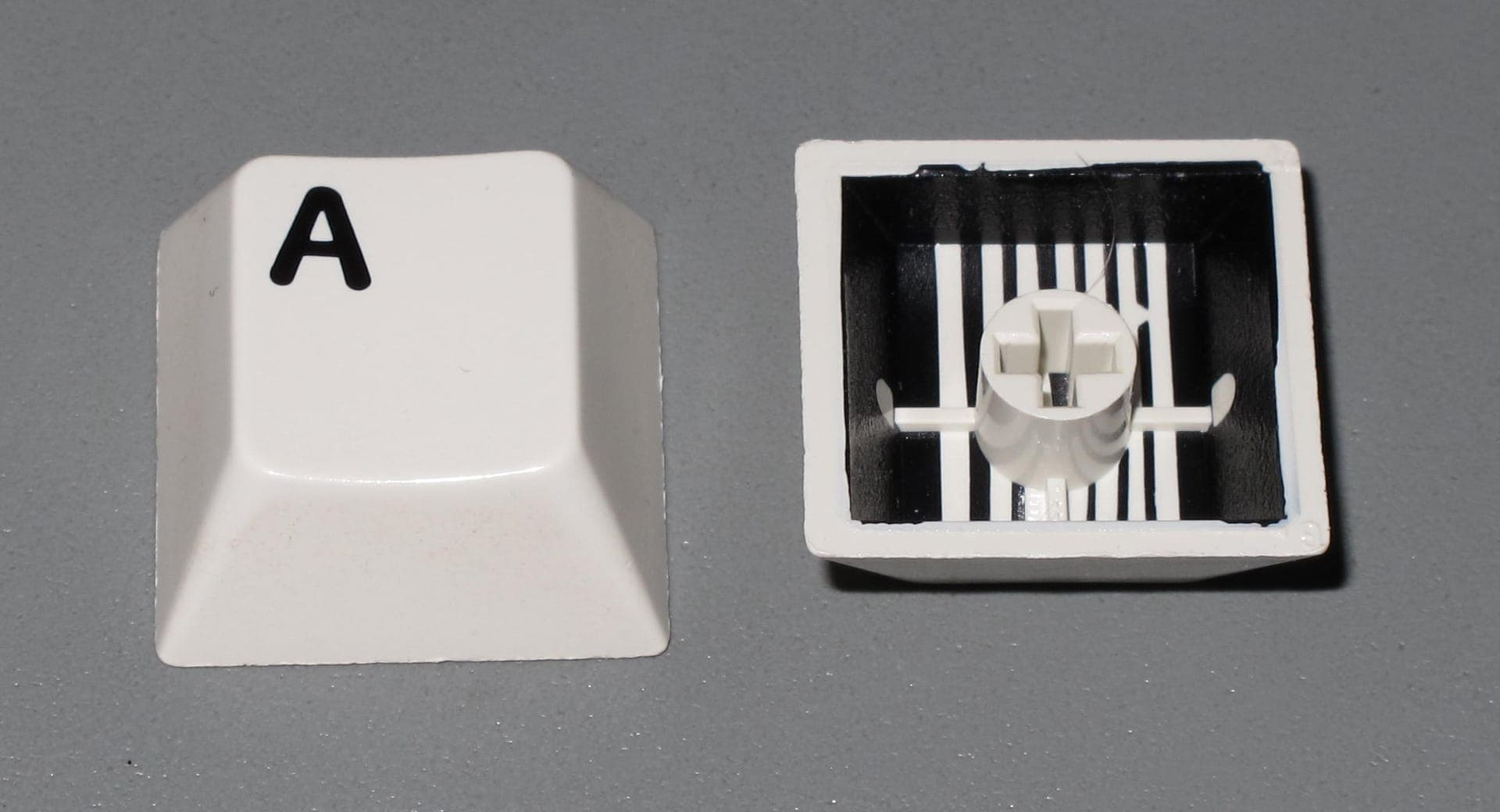Molded consumer product components in multiple colors and materials